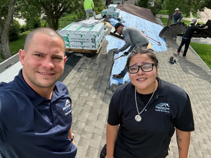 Innovative Roofing team on a Kansas City area roof replacement, with new underlayment going down after tear-off