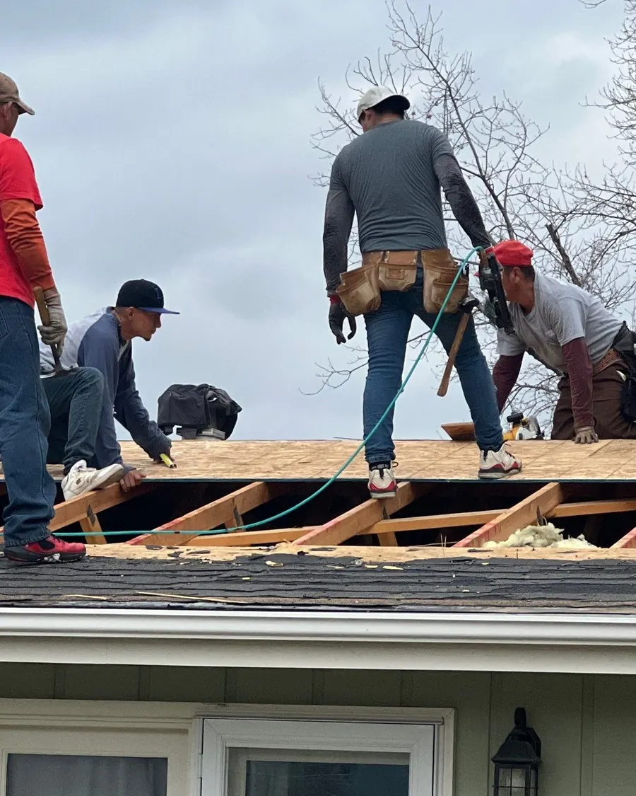 Innovative Roofing crew working on the roof deck of an Omaha-area home during a replacement