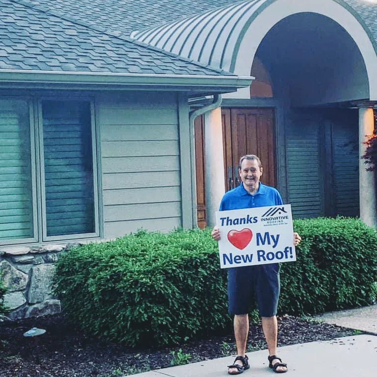 Omaha homeowner celebrating his new roof